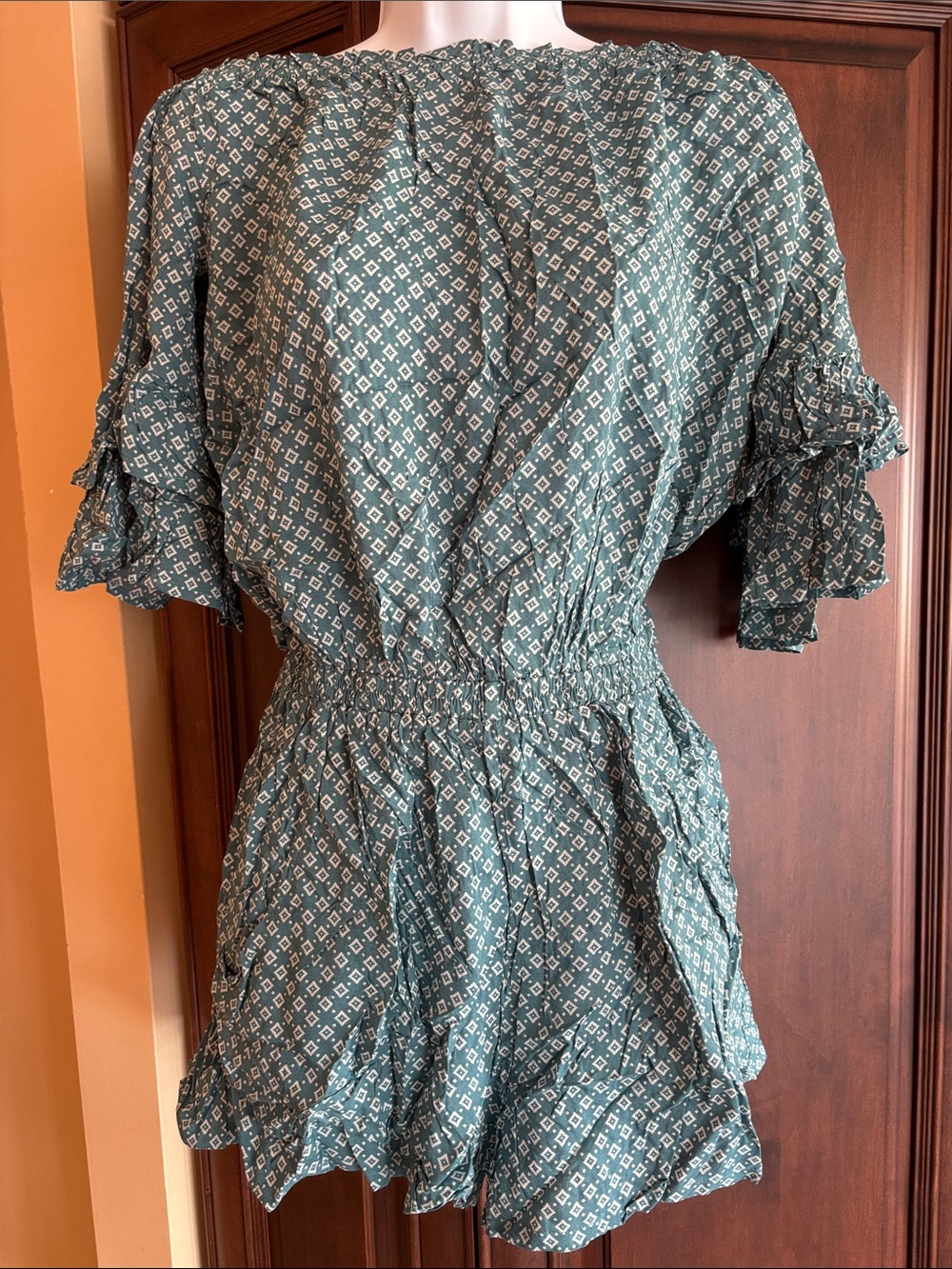 Printed Teal Smocked-Waist Romper with Ruffle Sleeves and Pockets
